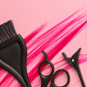 Hairstylist supplies on pink background. Cosmetology student kit. 